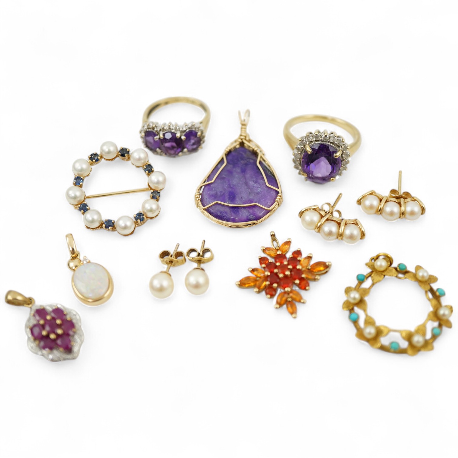 A collection of jewels, comprising: two amethyst and diamond rings; a cultured pearl and circular-cut sapphire wreath brooch; a fire opal pendant, one stone deficient; and a pair of cultured pearl earrings, all mounted i